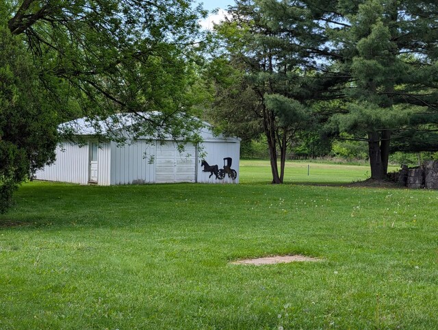 5062 Kendall Dr, Burton, MI 48509 - view of grassy yard with an outbuilding