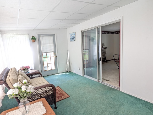 5062 Kendall Dr, Burton, MI 48509 - living room featuring carpet flooring, a drop ceiling, and baseboards