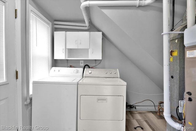 24350 Cloverlawn St, Oak Park, MI 48237 - laundry area featuring washer and clothes dryer, cabinet space, and wood finished floors