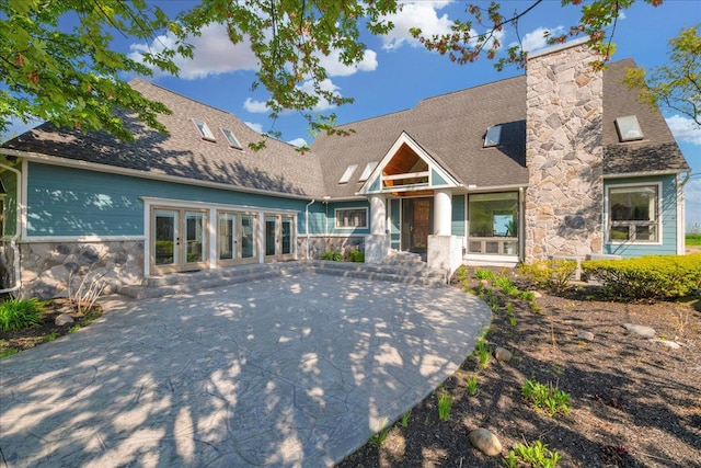 32630 Jefferson Ave, Saint Clair Shores, MI 48082 - view of front of home with stone siding, a patio, a chimney, and a shingled roof