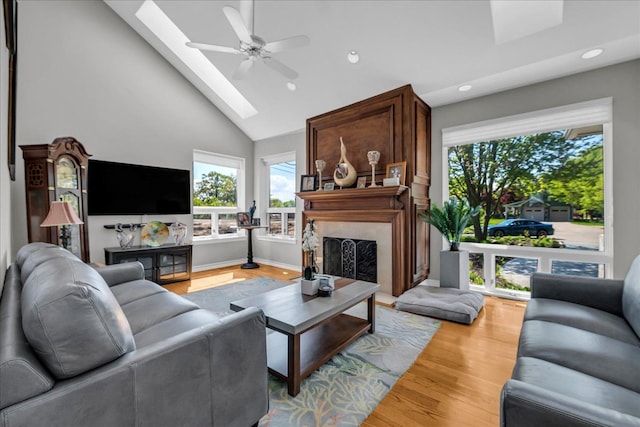 32630 Jefferson Ave, Saint Clair Shores, MI 48082 - living area with a skylight, a premium fireplace, recessed lighting, light wood-type flooring, and ceiling fan