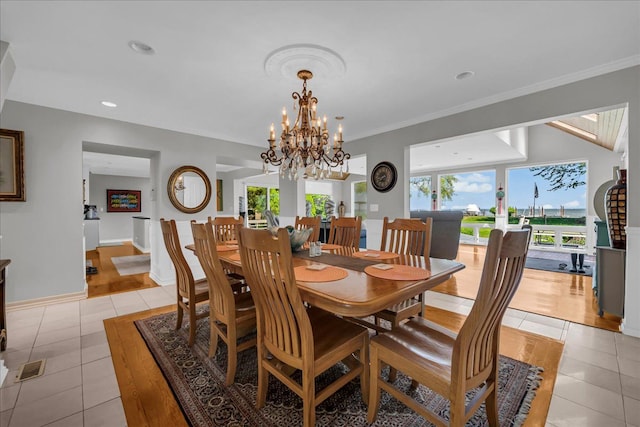 32630 Jefferson Ave, Saint Clair Shores, MI 48082 - dining room with light tile patterned flooring, a chandelier, baseboards, recessed lighting, and crown molding