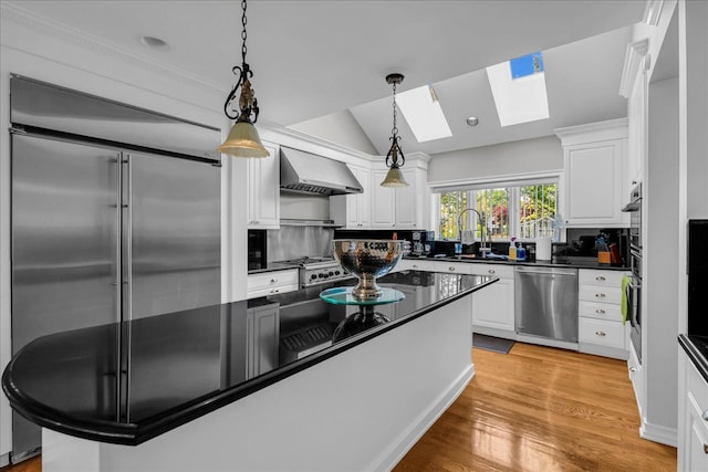 32630 Jefferson Ave, Saint Clair Shores, MI 48082 - kitchen with appliances with stainless steel finishes, wall chimney exhaust hood, a skylight, dark countertops, and a sink