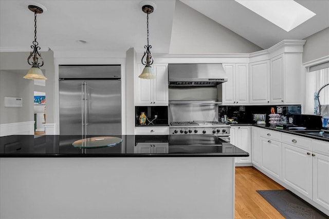 32630 Jefferson Ave, Saint Clair Shores, MI 48082 - kitchen featuring stainless steel built in fridge, wall chimney range hood, dark countertops, stove, and white cabinetry