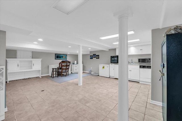 32630 Jefferson Ave, Saint Clair Shores, MI 48082 - finished below grade area featuring a sink, light tile patterned flooring, recessed lighting, freestanding refrigerator, and baseboards