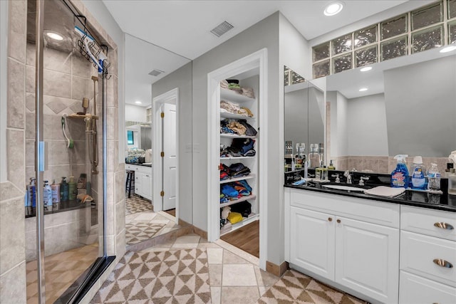 32630 Jefferson Ave, Saint Clair Shores, MI 48082 - full bath with a shower stall, vanity, a walk in closet, and recessed lighting