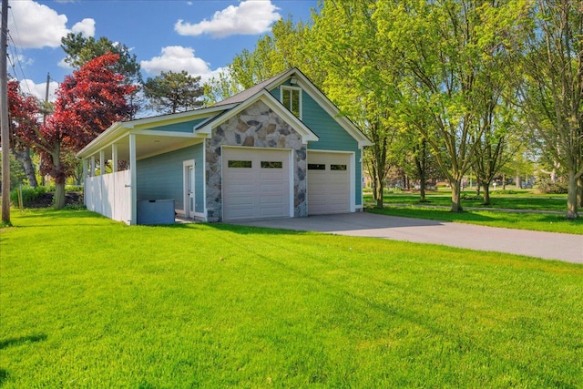 32630 Jefferson Ave, Saint Clair Shores, MI 48082 - view of front of house with stone siding, a front yard, concrete driveway, and an attached garage