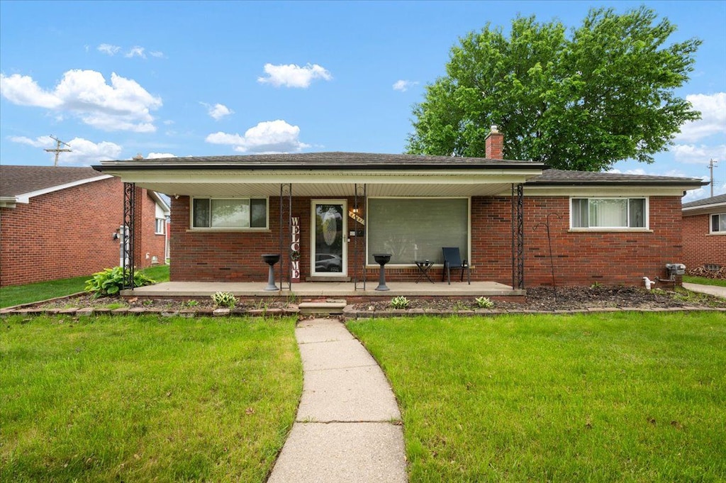 27607 Buckingham St, Livonia, MI 48154 - ranch-style home with covered porch, brick siding, a front yard, and a chimney