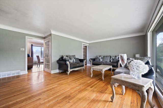 27607 Buckingham St, Livonia, MI 48154 - living room with light wood-style flooring and ornamental molding