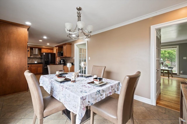 27607 Buckingham St, Livonia, MI 48154 - dining area featuring a chandelier, ornamental molding, recessed lighting, baseboards, and light tile patterned floors