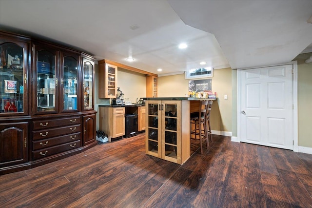 27607 Buckingham St, Livonia, MI 48154 - indoor bar with dark wood-style flooring, recessed lighting, and baseboards