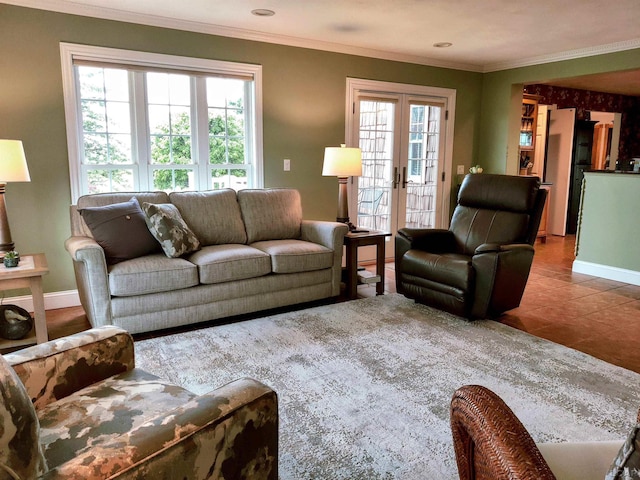 living area with ornamental molding, french doors, tile patterned flooring, and baseboards