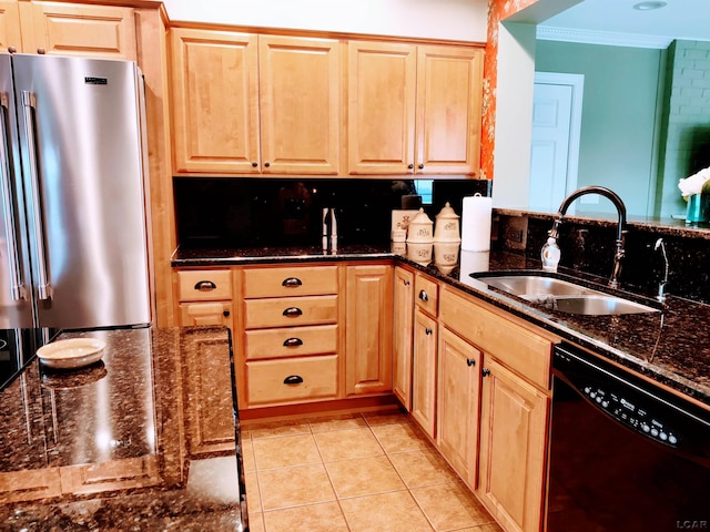 kitchen with dishwasher, freestanding refrigerator, a sink, ornamental molding, and light brown cabinets