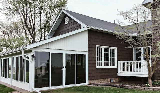 9642 Fike Rd, Blissfield, MI 49228 - view of property exterior featuring a sunroom and a shingled roof