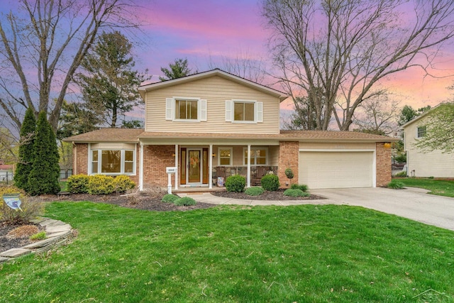 2303 Wilmington St, Midland, MI 48642 - traditional home featuring a garage, brick siding, concrete driveway, a porch, and a front yard