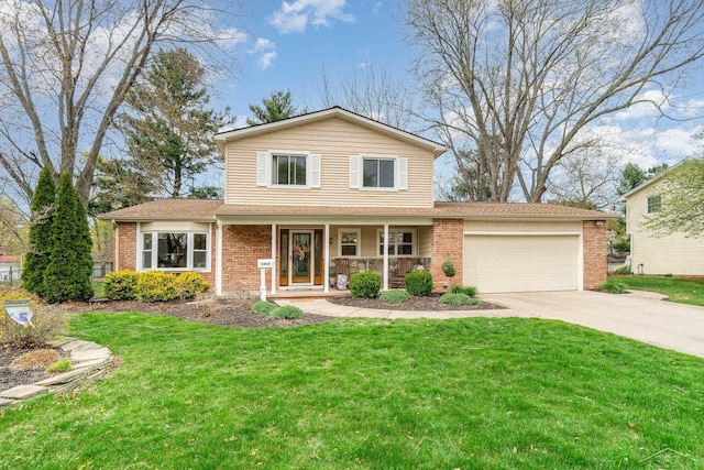 2303 Wilmington St, Midland, MI 48642 - traditional-style home featuring a porch, a garage, driveway, brick siding, and a front yard