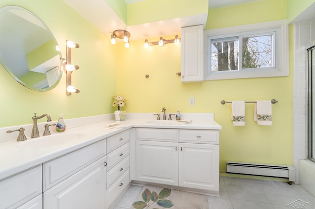 2303 Wilmington St, Midland, MI 48642 - bathroom featuring a baseboard heating unit, tile patterned flooring, and double vanity