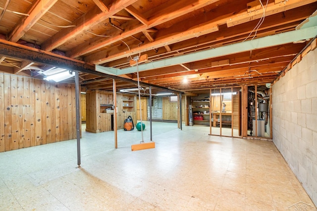 2303 Wilmington St, Midland, MI 48642 - unfinished below grade area with tile patterned floors and wooden walls