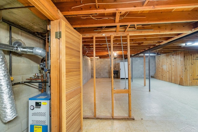 2303 Wilmington St, Midland, MI 48642 - unfinished below grade area with freestanding refrigerator and tile patterned floors