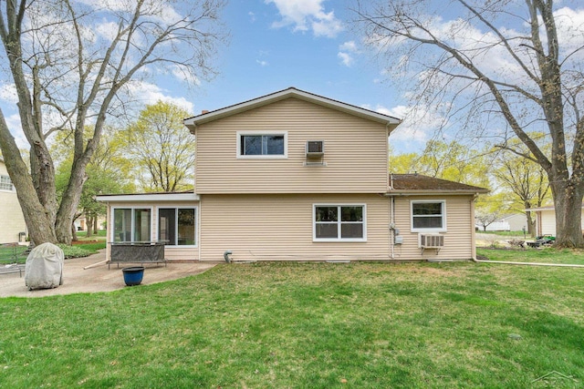 2303 Wilmington St, Midland, MI 48642 - back of house with a patio, a lawn, and a sunroom