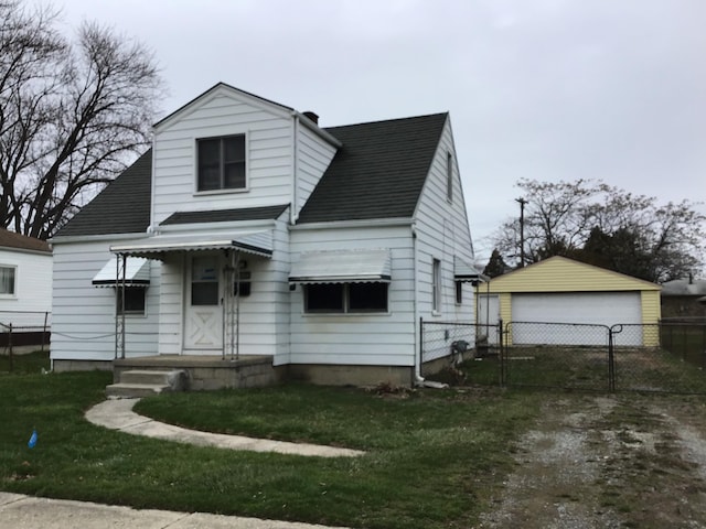 19595 Waldron St, Roseville, MI 48066 - view of front of property featuring a garage, a shingled roof, an outdoor structure, and a gate