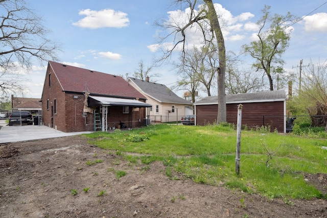 back of property with brick siding, fence, and cooling unit