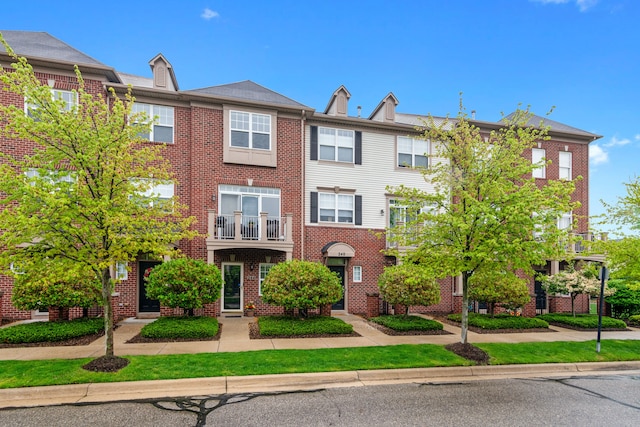 244 Wright St Unit 77, Wixom, MI 48393 - view of property featuring brick siding