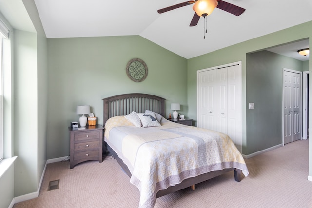244 Wright St Unit 77, Wixom, MI 48393 - carpeted bedroom with baseboards, vaulted ceiling, and ceiling fan
