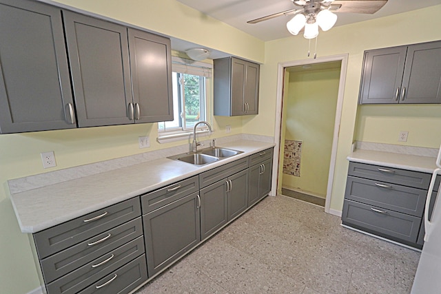 9963 Arnold, Redford, MI 48239 - kitchen with a sink, ceiling fan, baseboards, and gray cabinetry