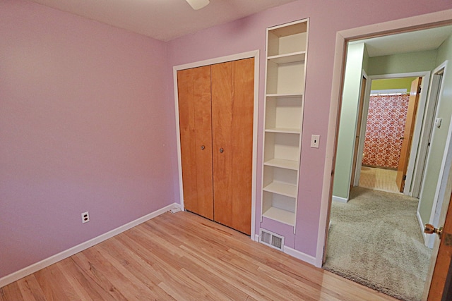 9963 Arnold, Redford, MI 48239 - unfurnished bedroom with baseboards, light wood-style flooring, a closet, and ceiling fan