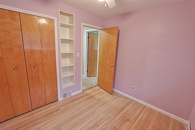 9963 Arnold, Redford, MI 48239 - unfurnished bedroom featuring light wood finished floors, baseboards, a closet, and a ceiling fan