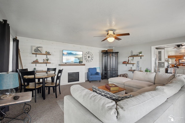 3131 Morin Point St, Erie, MI 48133 - carpeted living area featuring ceiling fan and a glass covered fireplace