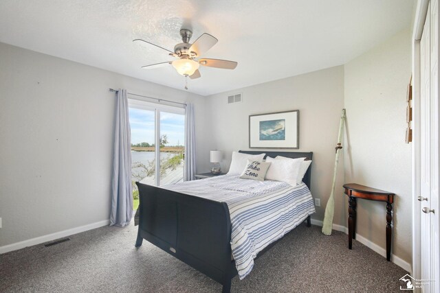 3131 Morin Point St, Erie, MI 48133 - bedroom with light colored carpet, baseboards, ceiling fan, and a water view