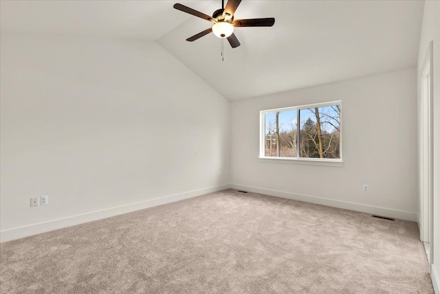 6514 Cambridge Cir, Clarkston, MI 48346 - spare room with vaulted ceiling, ceiling fan, carpet flooring, and baseboards