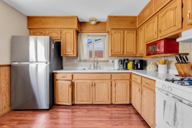 33945 Birchwood St, Westland, MI 48186 - kitchen with freestanding refrigerator, a sink, white gas range, and light countertops