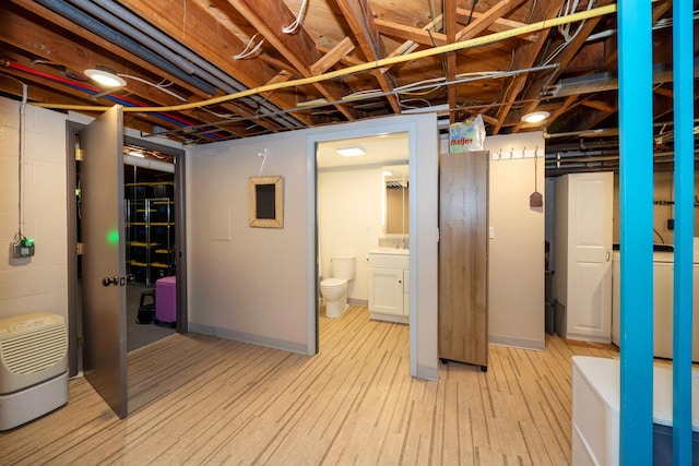 1066 Knight Rd, Ann Arbor, MI 48103 - below grade area featuring light wood-style floors and a sink