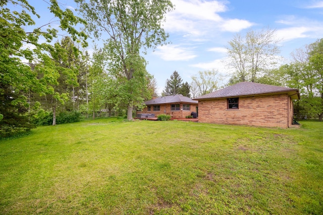 1066 Knight Rd, Ann Arbor, MI 48103 - view of green lawn featuring a wooden deck