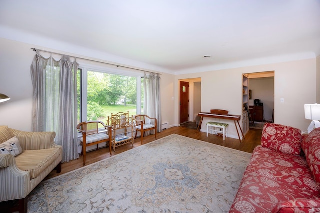 1066 Knight Rd, Ann Arbor, MI 48103 - living area featuring wood finished floors, a baseboard heating unit, and baseboards