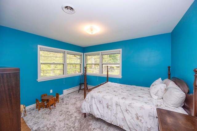 1066 Knight Rd, Ann Arbor, MI 48103 - bedroom featuring baseboards and baseboard heating
