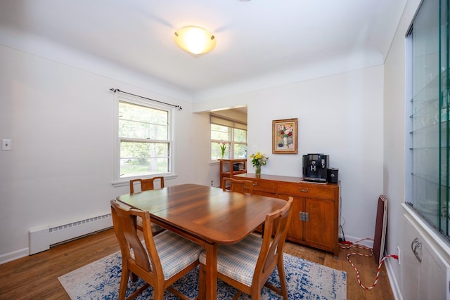 1066 Knight Rd, Ann Arbor, MI 48103 - dining area with baseboard heating, light wood-style flooring, and baseboards
