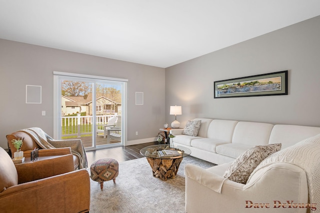 living room with wood finished floors and baseboards