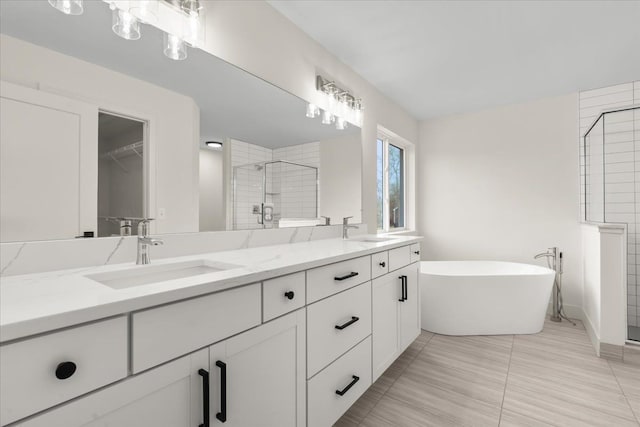6515 Cambridge Cir, Clarkston, MI 48346 - full bath with a stall shower, double vanity, a soaking tub, and a walk in closet