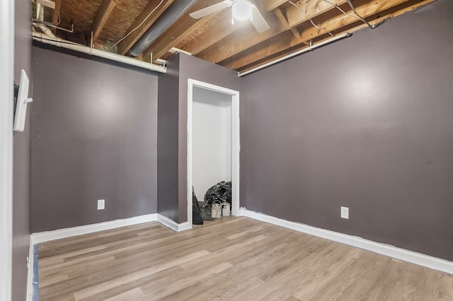 19101 Weller Rd, Gregory, MI 48137 - below grade area featuring wood finished floors, baseboards, and a ceiling fan