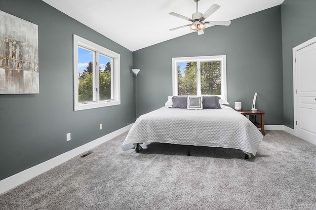 19101 Weller Rd, Gregory, MI 48137 - bedroom featuring multiple windows, carpet, vaulted ceiling, and baseboards
