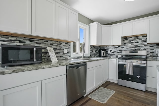 19101 Weller Rd, Gregory, MI 48137 - kitchen featuring stainless steel appliances, a sink, decorative backsplash, and white cabinets