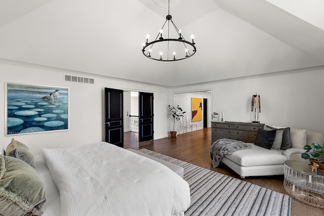 bedroom with a chandelier, high vaulted ceiling, dark wood-style flooring, and ornamental molding