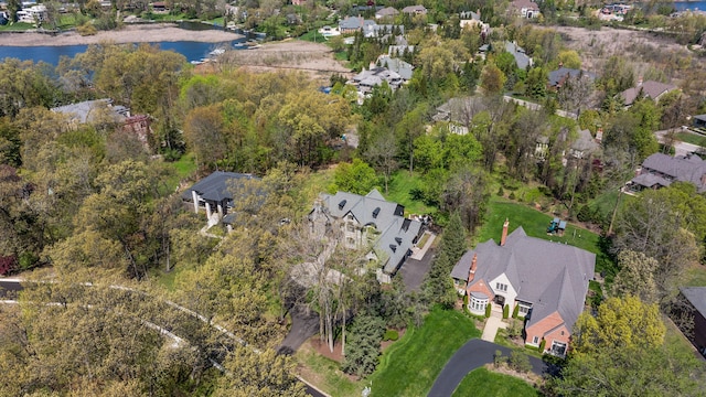 view of property location with a nearby body of water and nearby suburban area