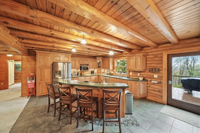 3380 Norvell Rd, Grass Lake, MI 49240 - kitchen featuring appliances with stainless steel finishes, dark countertops, a center island, beamed ceiling, and tile patterned floors