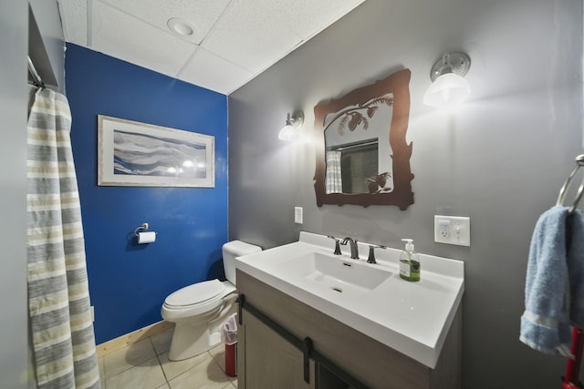 3380 Norvell Rd, Grass Lake, MI 49240 - bathroom featuring toilet, tile patterned flooring, vanity, and a paneled ceiling