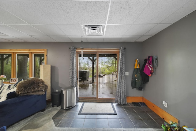 3380 Norvell Rd, Grass Lake, MI 49240 - entryway with a drop ceiling, tile patterned floors, and baseboards
